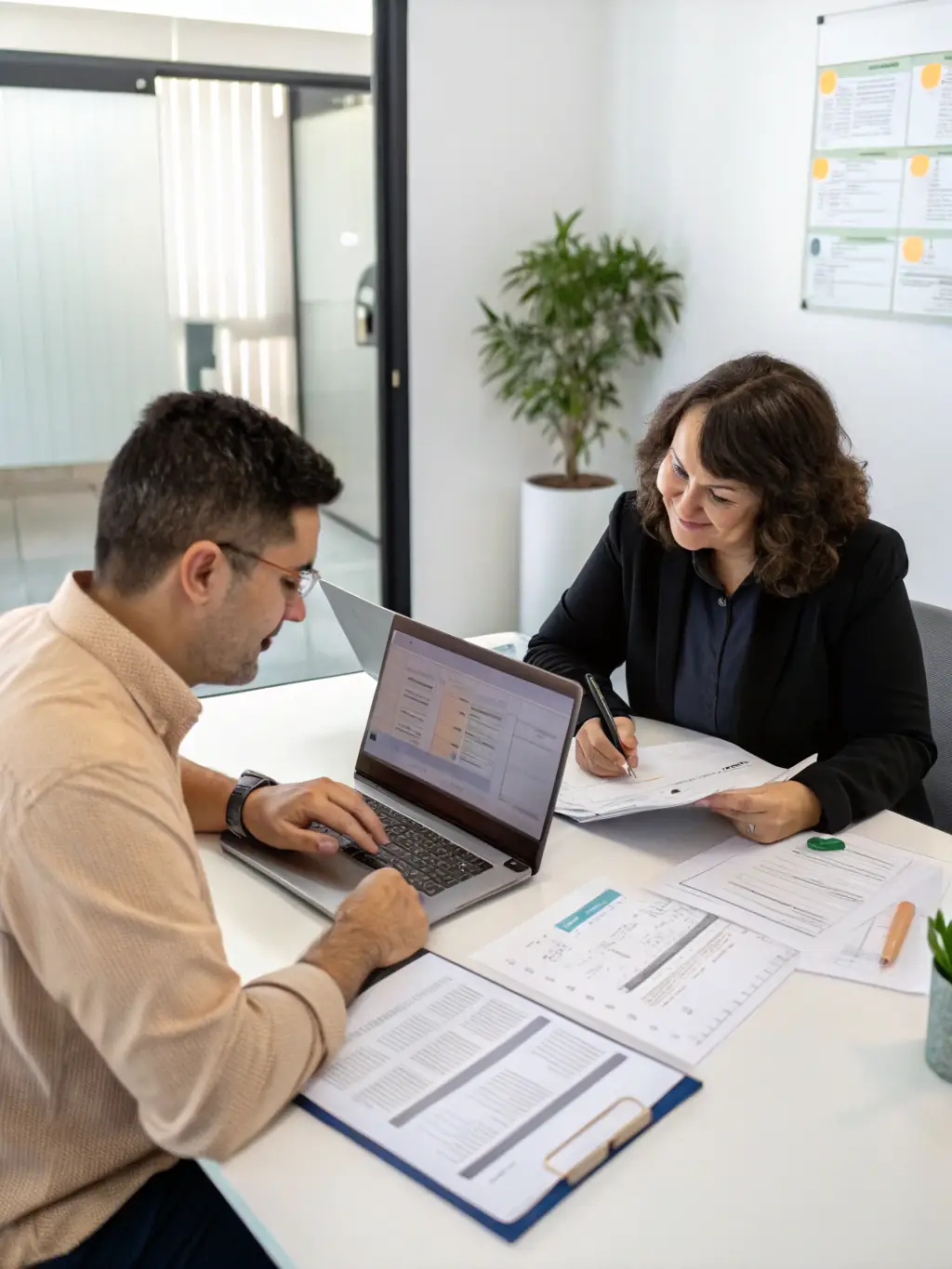 A business owner reviewing inventory with a financial advisor, symbolizing quick funding solutions for Monumental Funding Solutions.